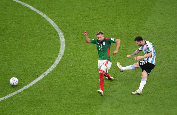 Lionel Messi pictured (right) scoring for Argentina against Mexico at the 2022 FIFA World Cup in Qatar